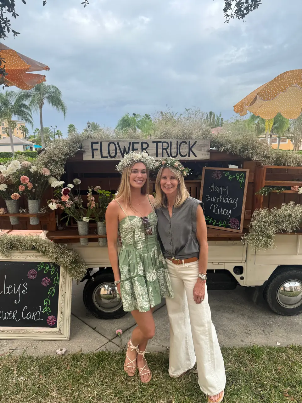 Mother and daughter wearing baby’s breath flower crowns in front of the truck
